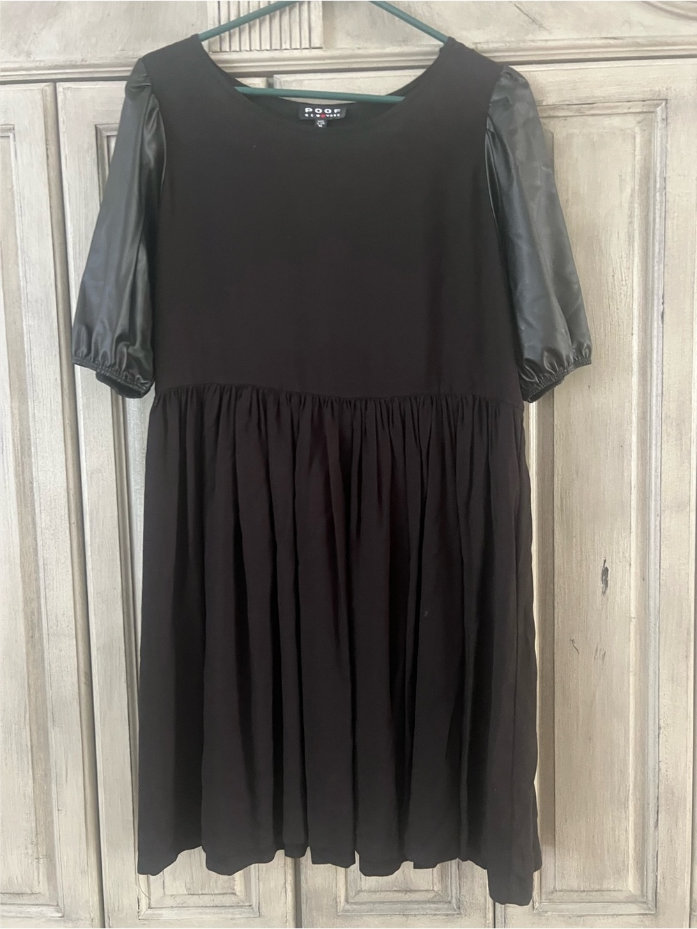Soft knee length dress with pleather sleeves.   Size XL.